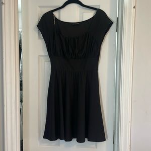 Brand new never worn black tight waist dress with flowy bottom. Size Medium.